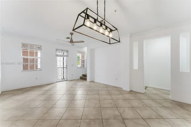 a view of an empty room with windows