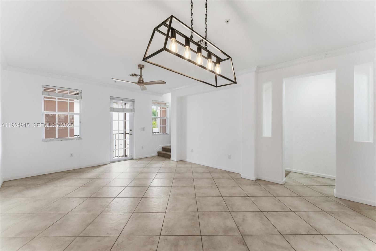 2651 Southwest 119th Terrace, Unit 1109 Miramar, FL 33025 - Photo 10 of 25 a view of an empty room with windows