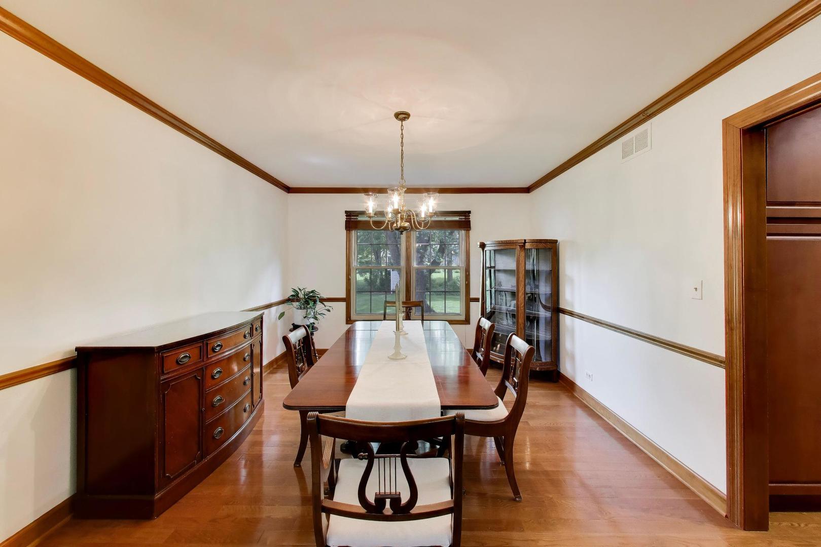 1528 Sequoia Road Naperville, IL 60540 - Photo 8 of 34 a view of a dining room with furniture window and wooden floor