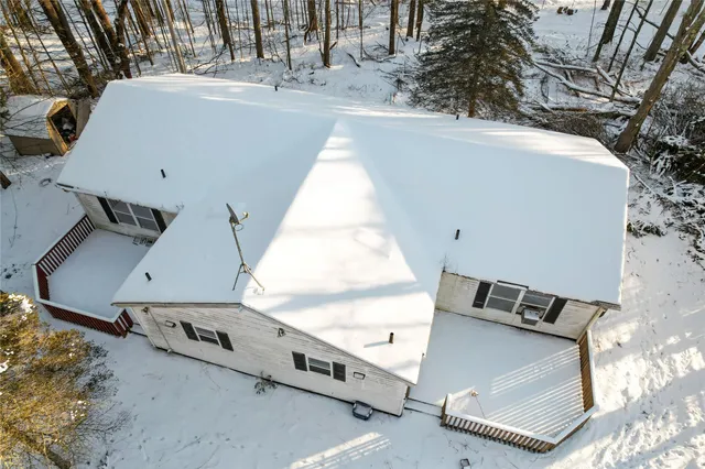 an aerial view of a house with outdoor space