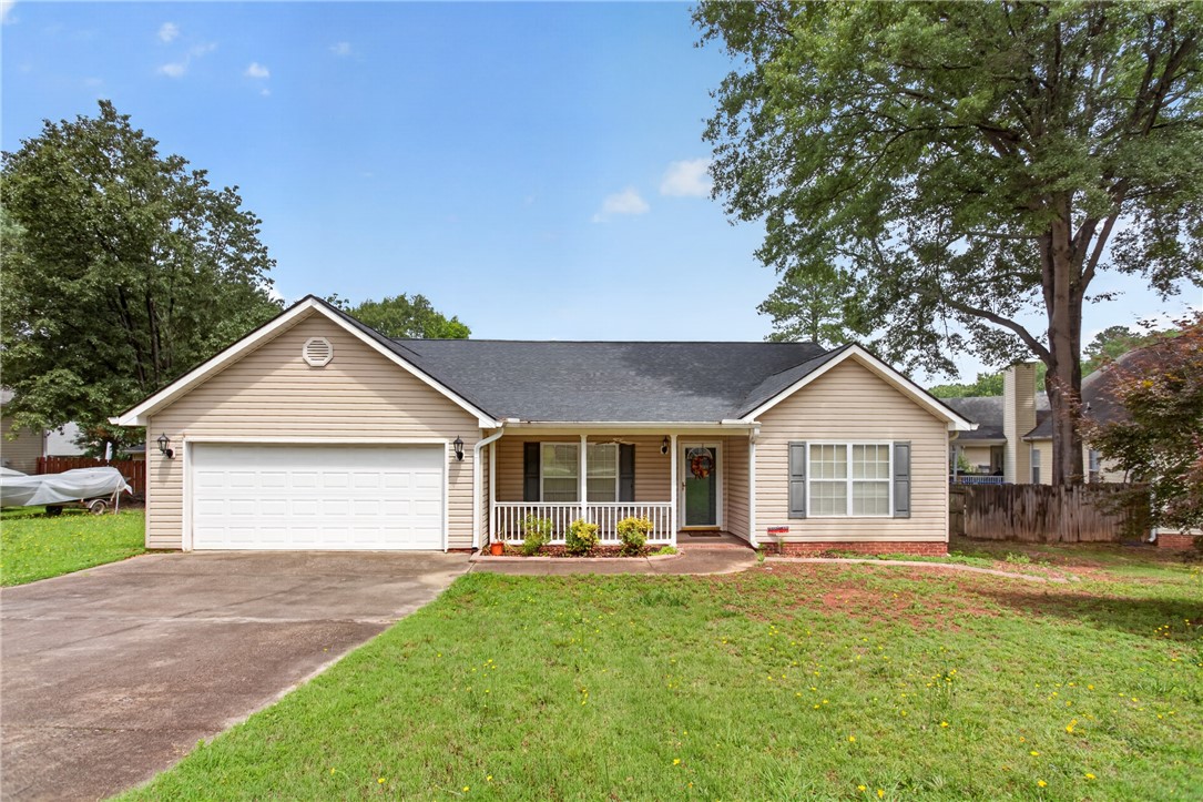 207 Hunters Lane Anderson, SC 29625 - Photo 1 of 46 A welcoming front porch invites you into this charming home with an attached two car garage.