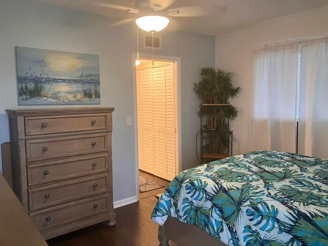 a bedroom with a bed and a dresser