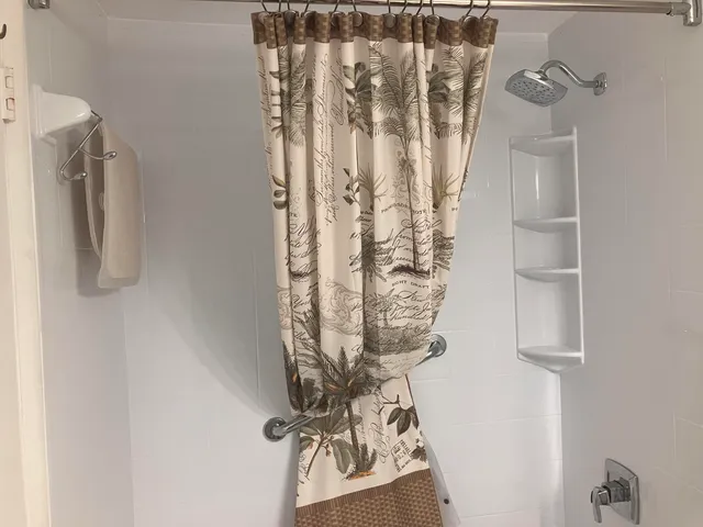 a bathroom with a shower curtain