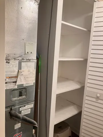 a view of bathroom with a sink and mirror