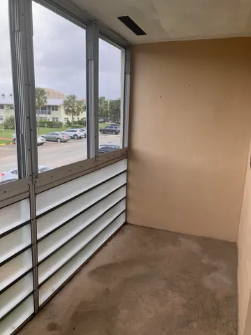 a view of a room with a large window