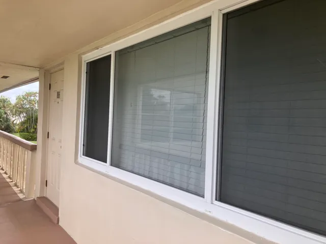 a view of a door and a window