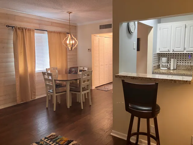 a dining room with furniture and window