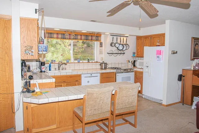 a dining table with chairs and window