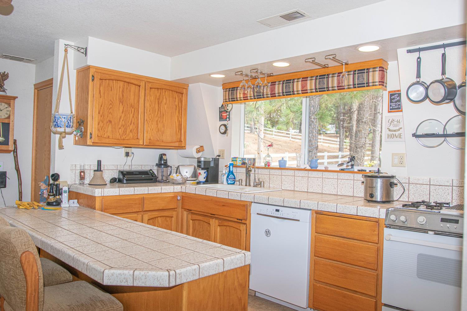5010 Hope Mountain Road Georgetown, CA 95634 - Photo 13 of 42 a kitchen with stainless steel appliances granite countertop a sink a stove and cabinets
