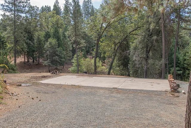 a view of a chairs and table in the roadside