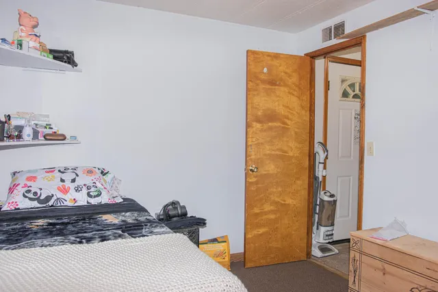 a bathroom with a sink vanity mirror and toilet
