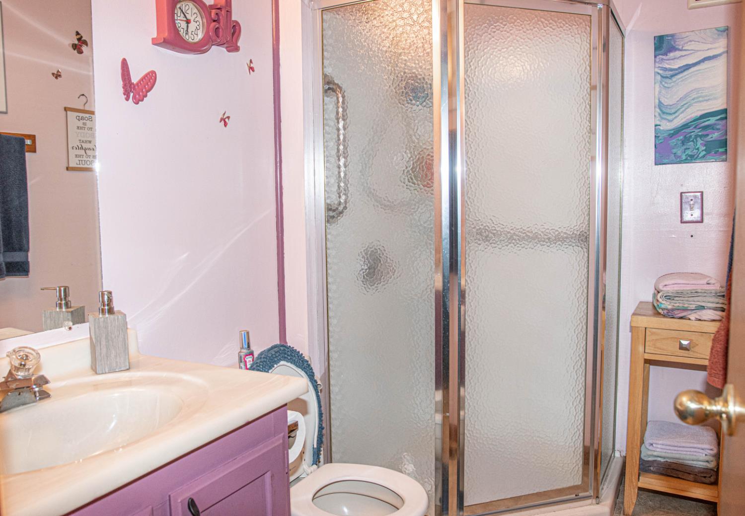 5010 Hope Mountain Road Georgetown, CA 95634 - Photo 38 of 42 a bathroom with a sink vanity mirror and toilet