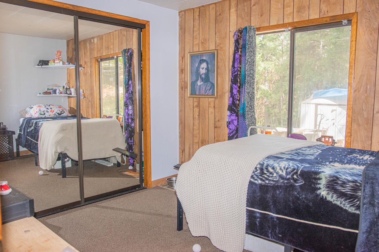 5010 Hope Mountain Road Georgetown, CA 95634 - Photo 40 of 42 a bed sitting in a bedroom next to a window