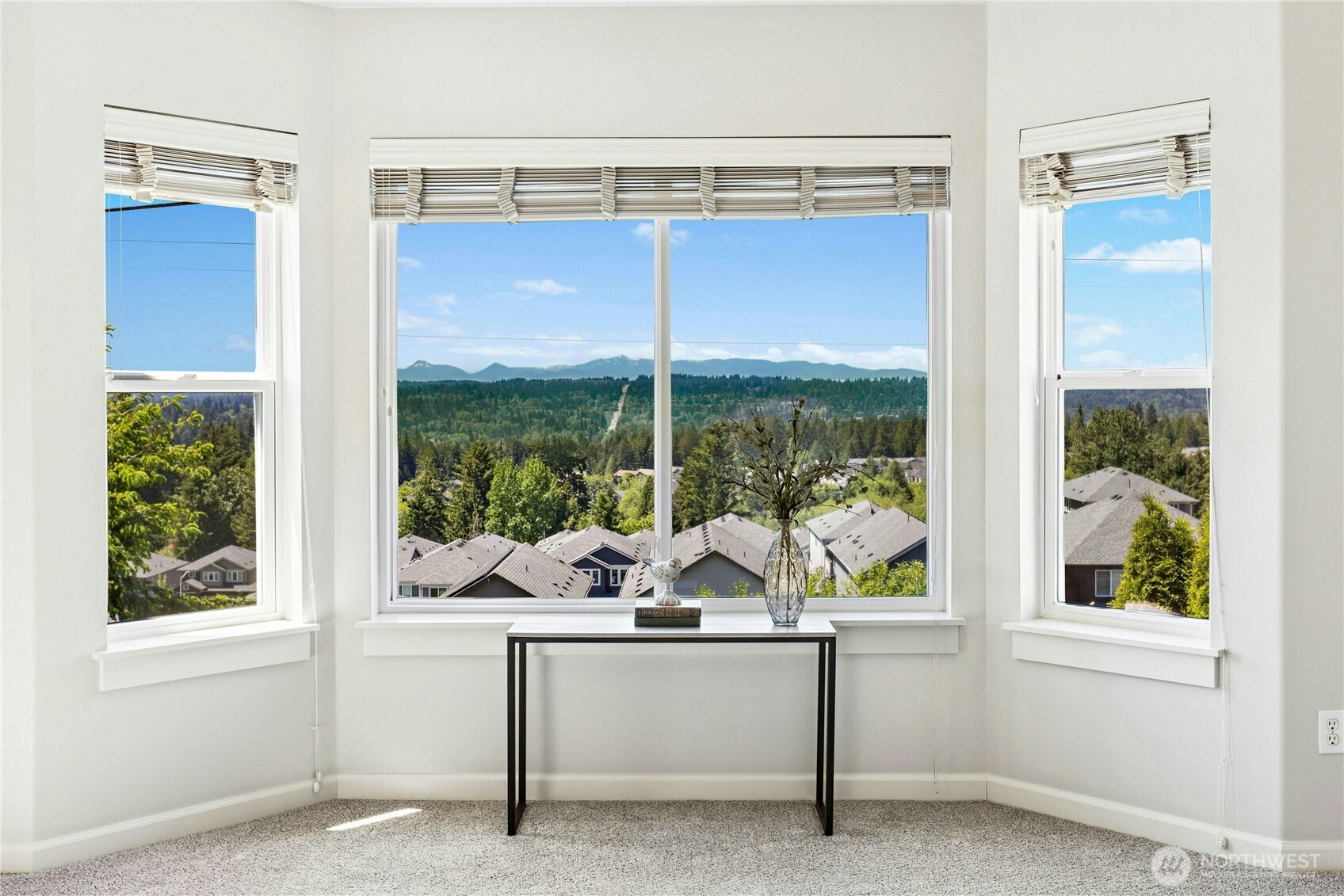 22624 43rd Drive Southeast Bothell, WA 98021 - Photo 17 of 36 a large window and a table chair in the balcony