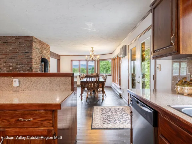a bathroom with a sink a bathtub and a window