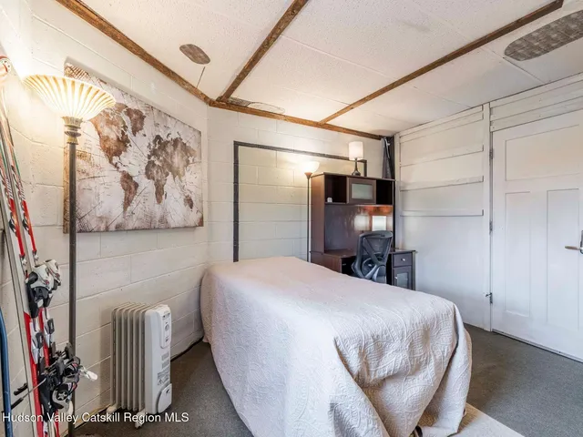 a swimming pool with outdoor seating and yard