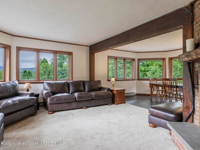 a view of a dining room with furniture window and outside view