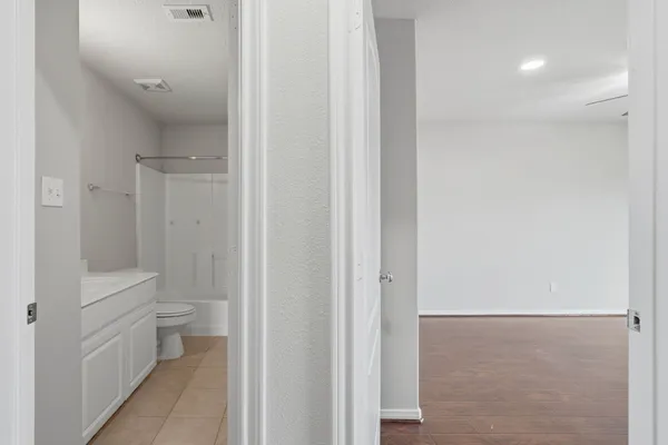 a bathroom with white walls