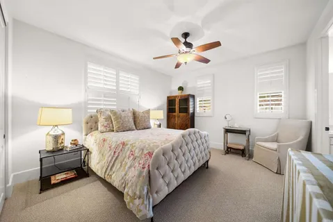 a view of a house with backyard sitting area and garden