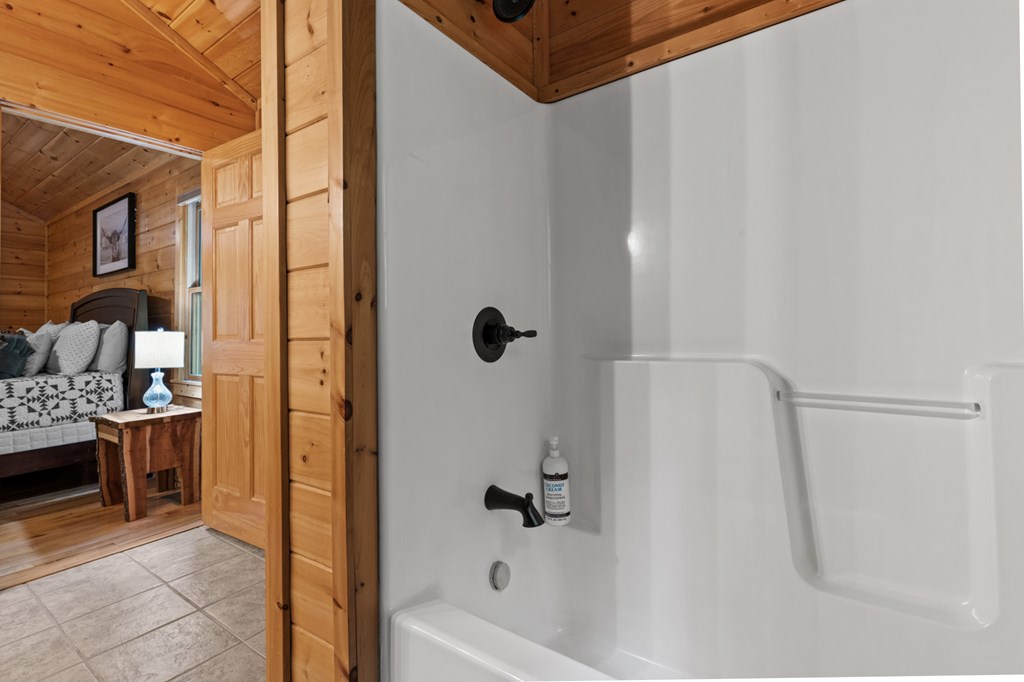 220 Solar Drive Blue Ridge, GA 30513 - Photo 37 of 59 a bathroom with a tub and shower