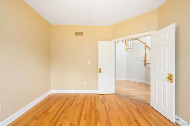 a view of hallway with wooden floor