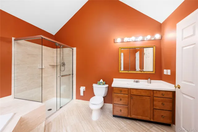 a spacious bathroom with a double vanity sink and a mirror