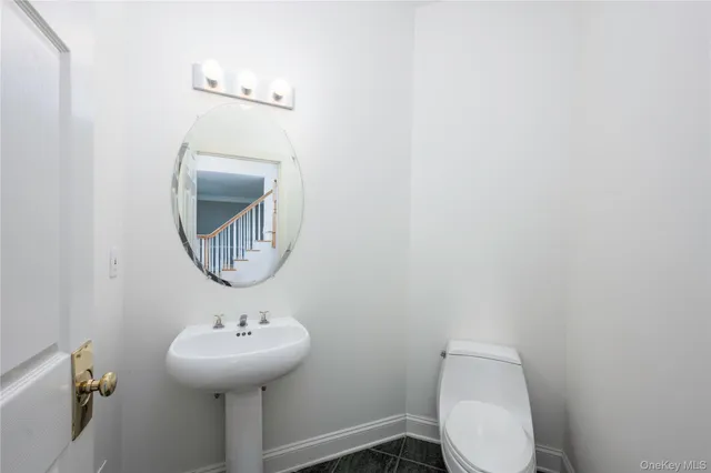 a bathroom with a toilet and a sink