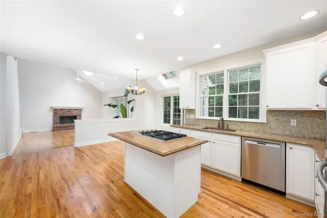 a kitchen with granite countertop a stove and a sink