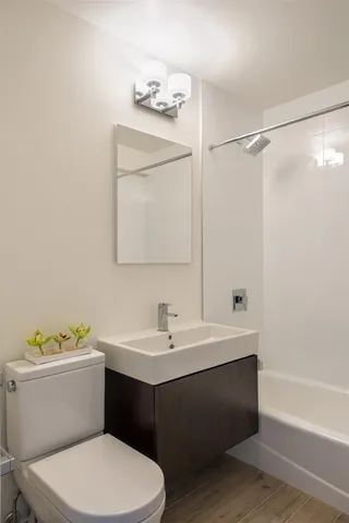 a bathroom with a sink toilet and vanity