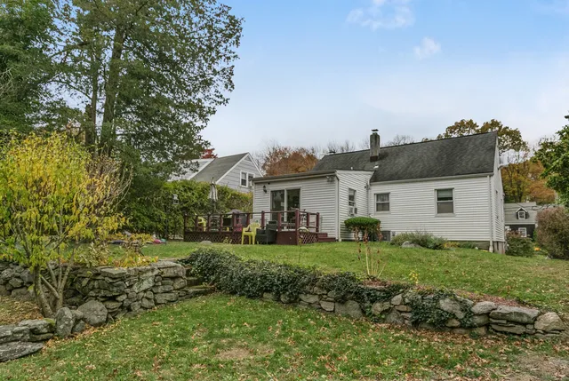 a view of a deck with two chair and wooden floor