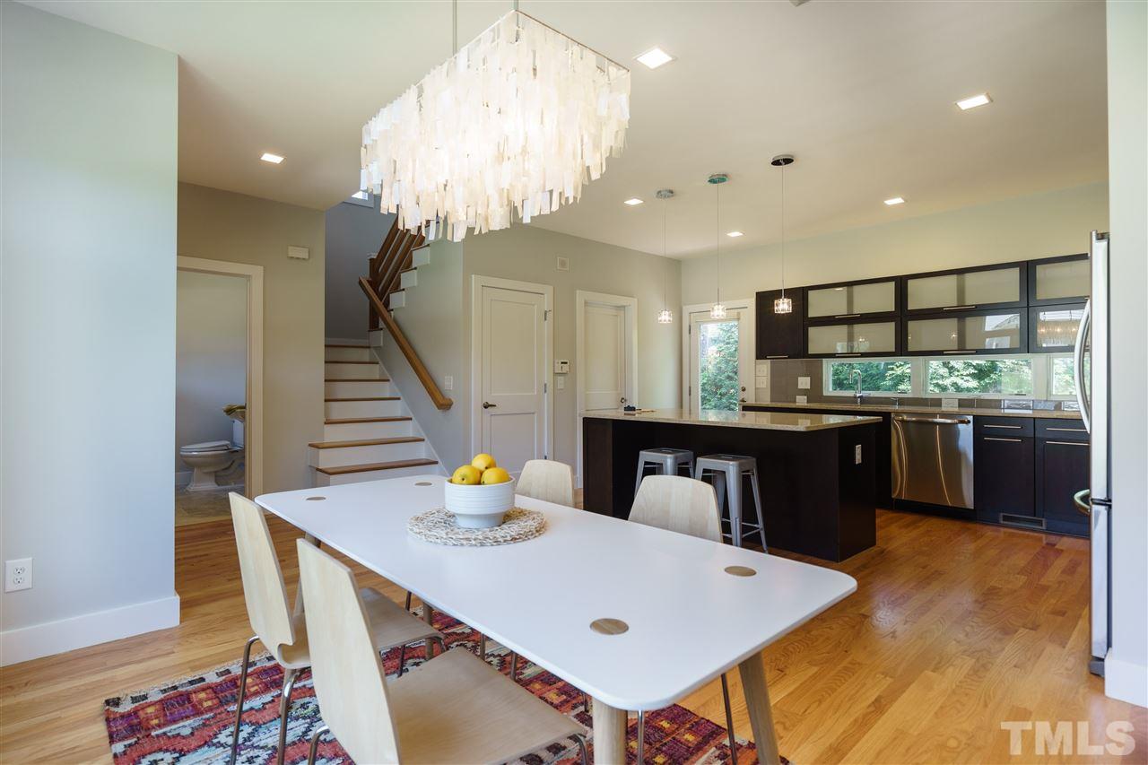 2514 Colton Place Raleigh, NC 27609 - Photo 14 of 25 a kitchen with a table and chairs
