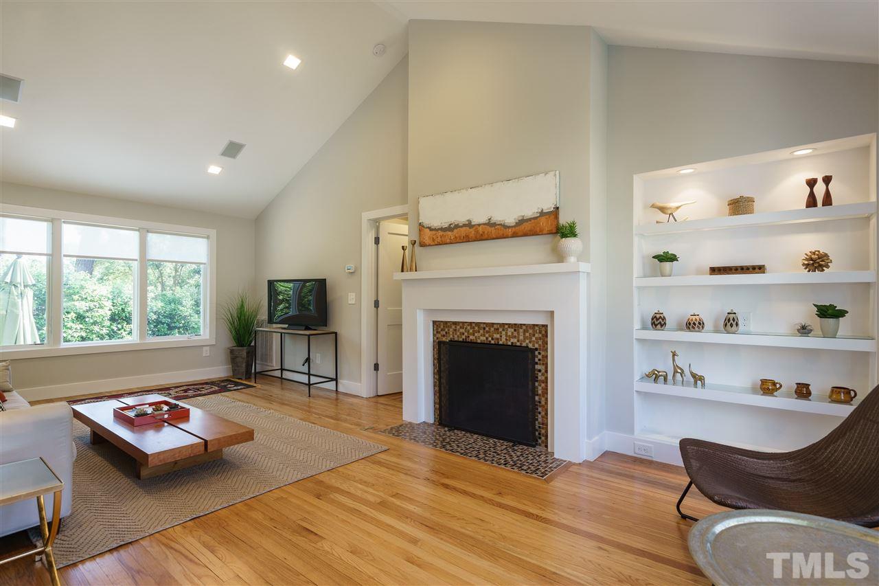 2514 Colton Place Raleigh, NC 27609 - Photo 3 of 25 a living room with furniture fireplace and window