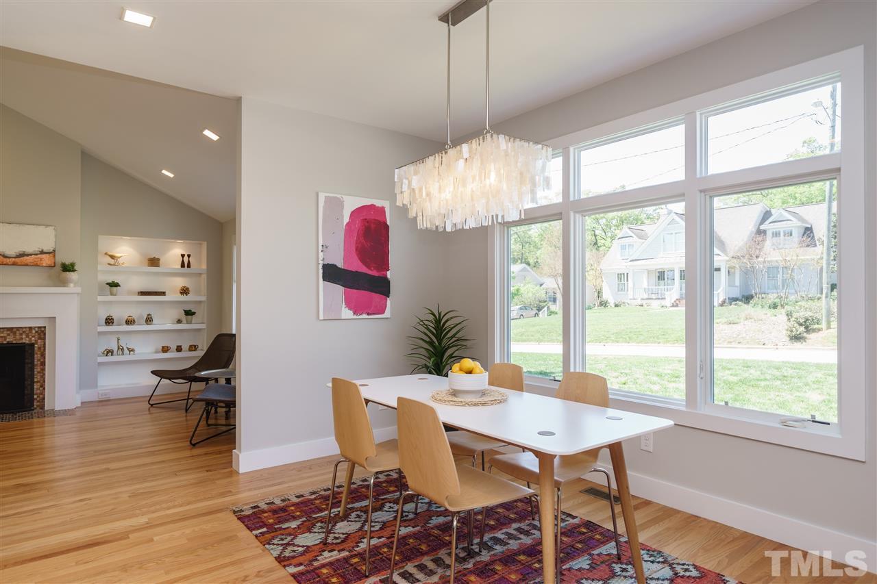 2514 Colton Place Raleigh, NC 27609 - Photo 8 of 25 a view of a dining room with furniture window and wooden floor