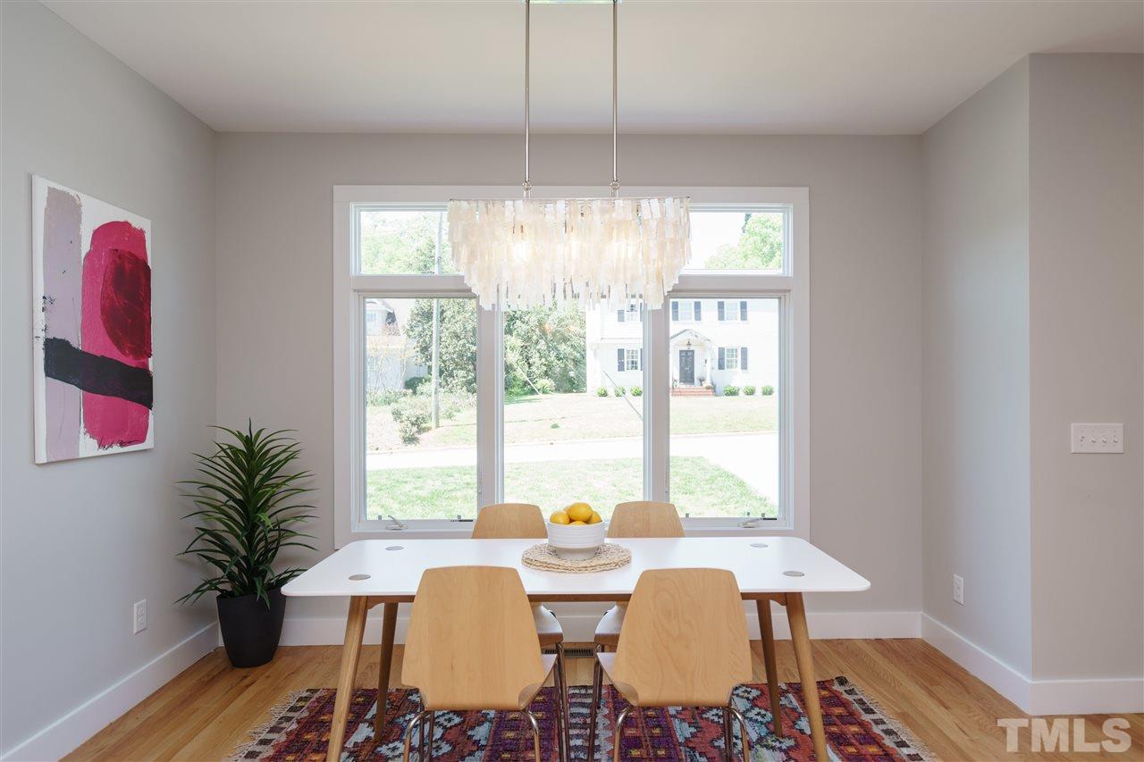 2514 Colton Place Raleigh, NC 27609 - Photo 9 of 25 a view of a dining room with furniture window and wooden floor