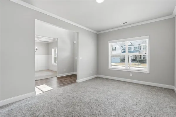 a view of an empty room with a window