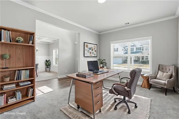 a workspace with furniture and window