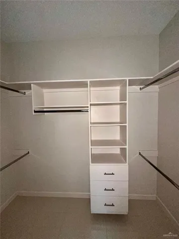a view of an empty walk in closet