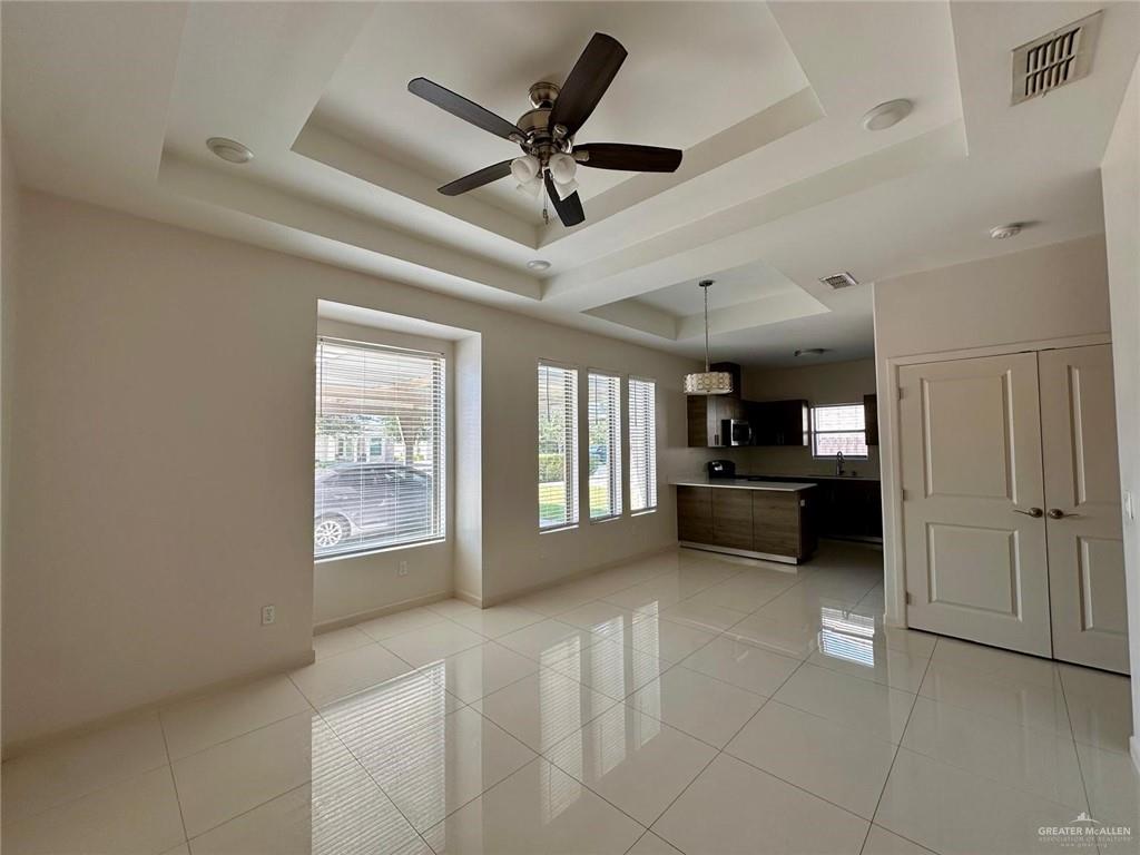5700 Nightingale Avenue, Unit 1 Mission, TX 78573 - Photo 2 of 21 a living room with furniture and a ceiling fan