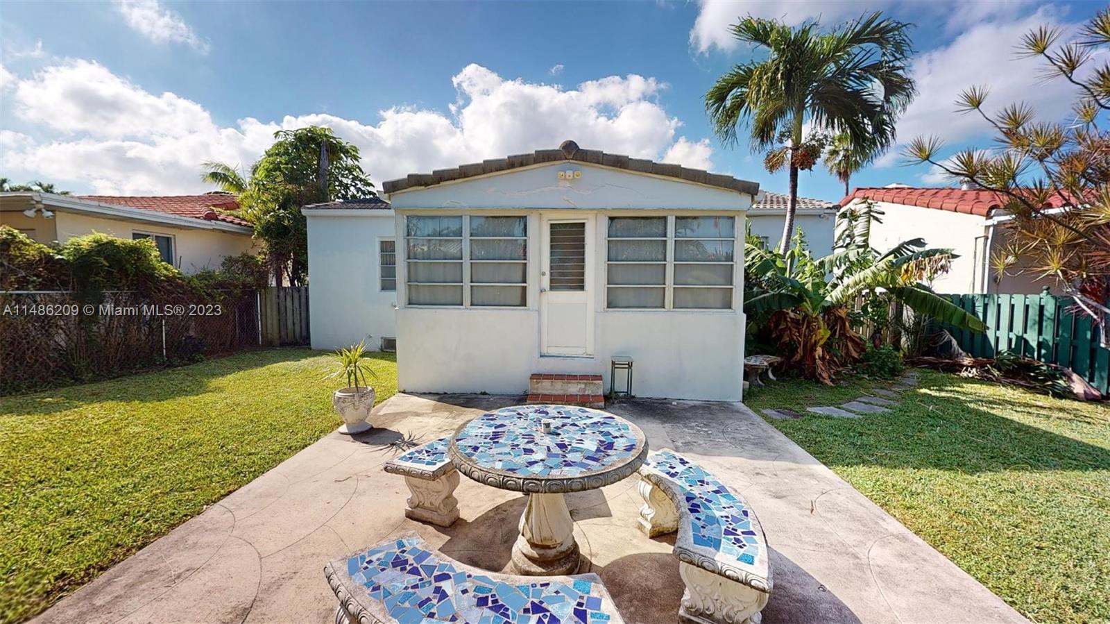 Normandy Beach Surfside, FL 33154 - Photo 17 of 22 a front view of a house with garden