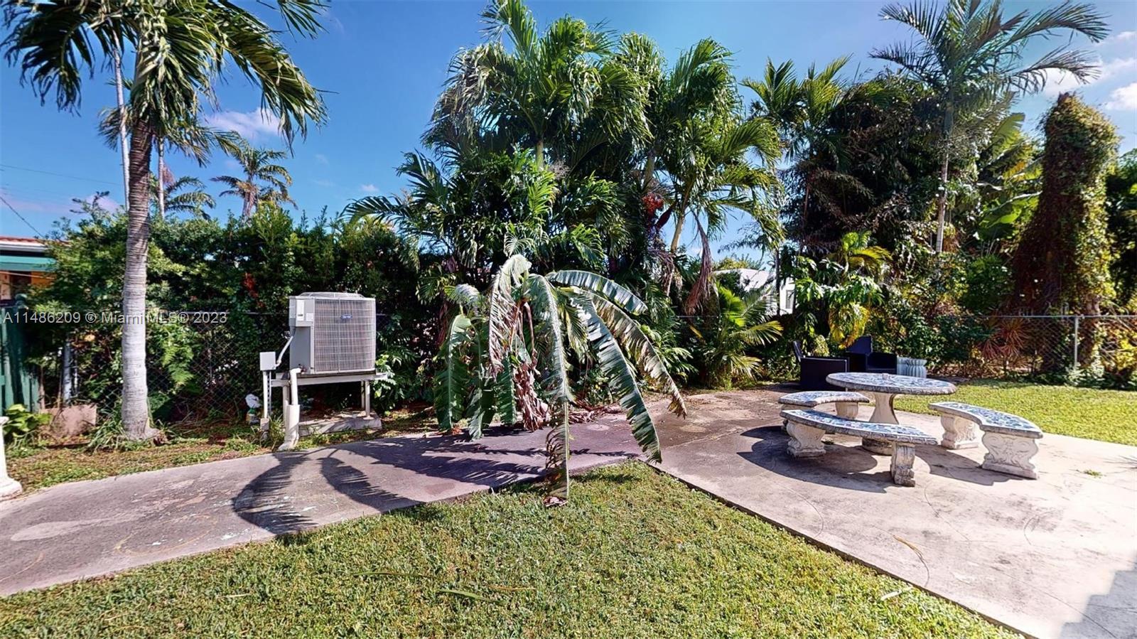 Normandy Beach Surfside, FL 33154 - Photo 18 of 22 a view of a backyard with plants and patio