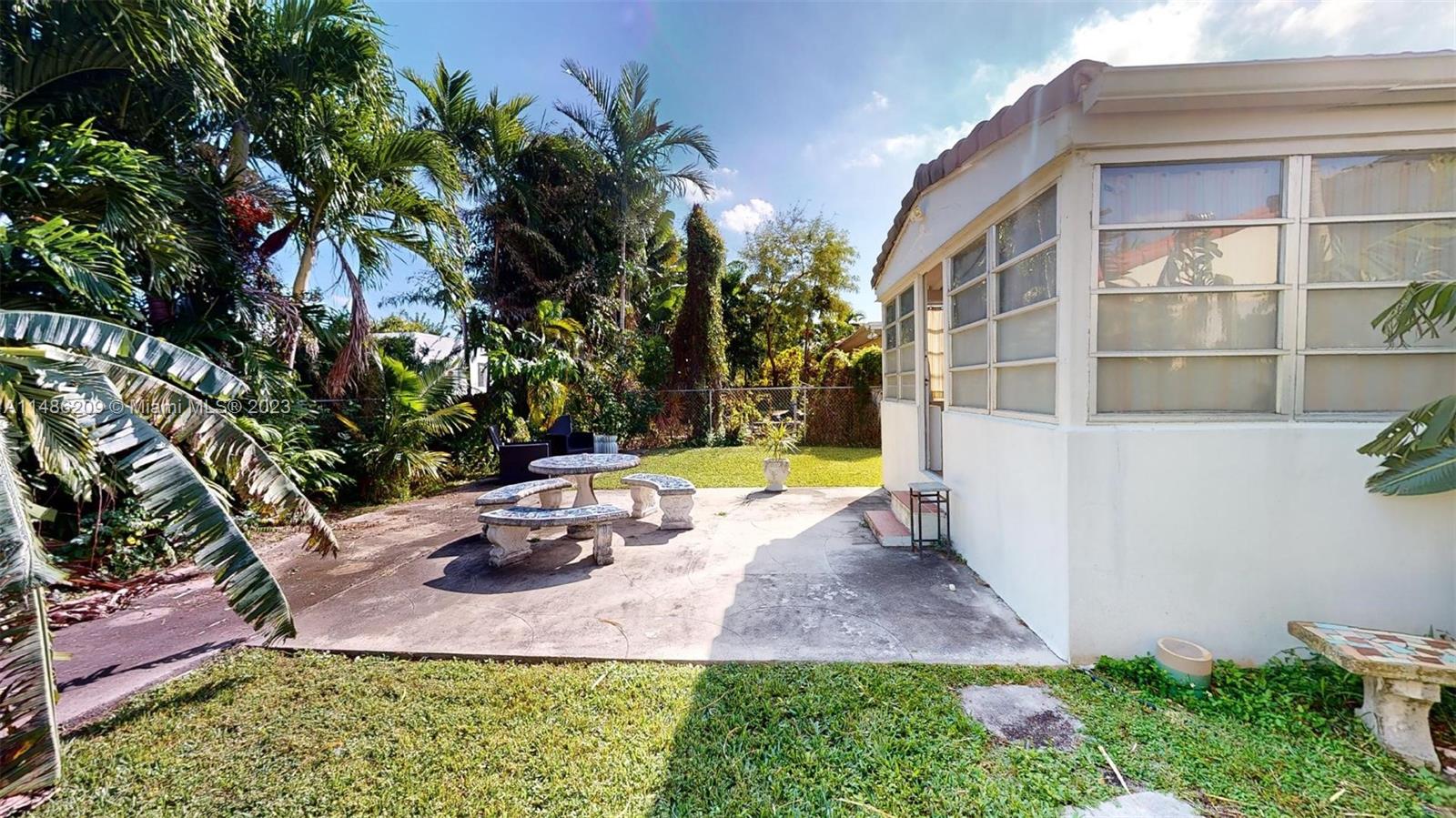 Normandy Beach Surfside, FL 33154 - Photo 19 of 22 a view of a house with backyard and sitting area