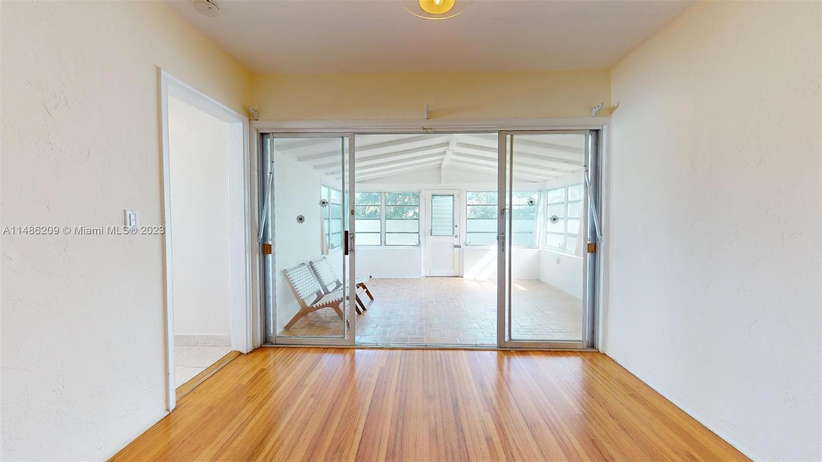 Normandy Beach Surfside, FL 33154 - Photo 8 of 22 a view of empty room with wooden floor