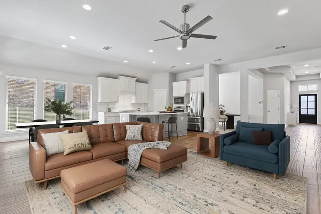 a living room with furniture and a large window