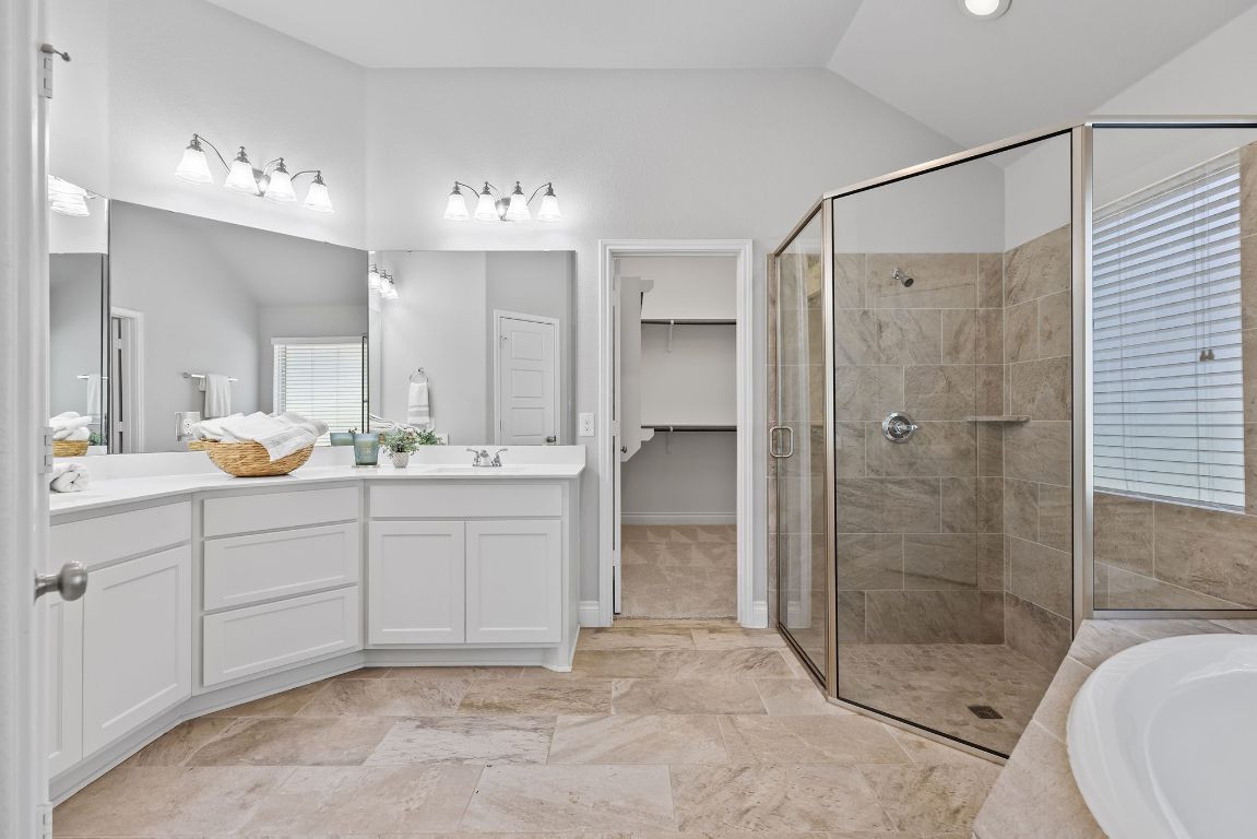 3604 Mercer Road Georgetown, TX 78628 - Photo 22 of 39 a bathroom with a shower sink and mirror