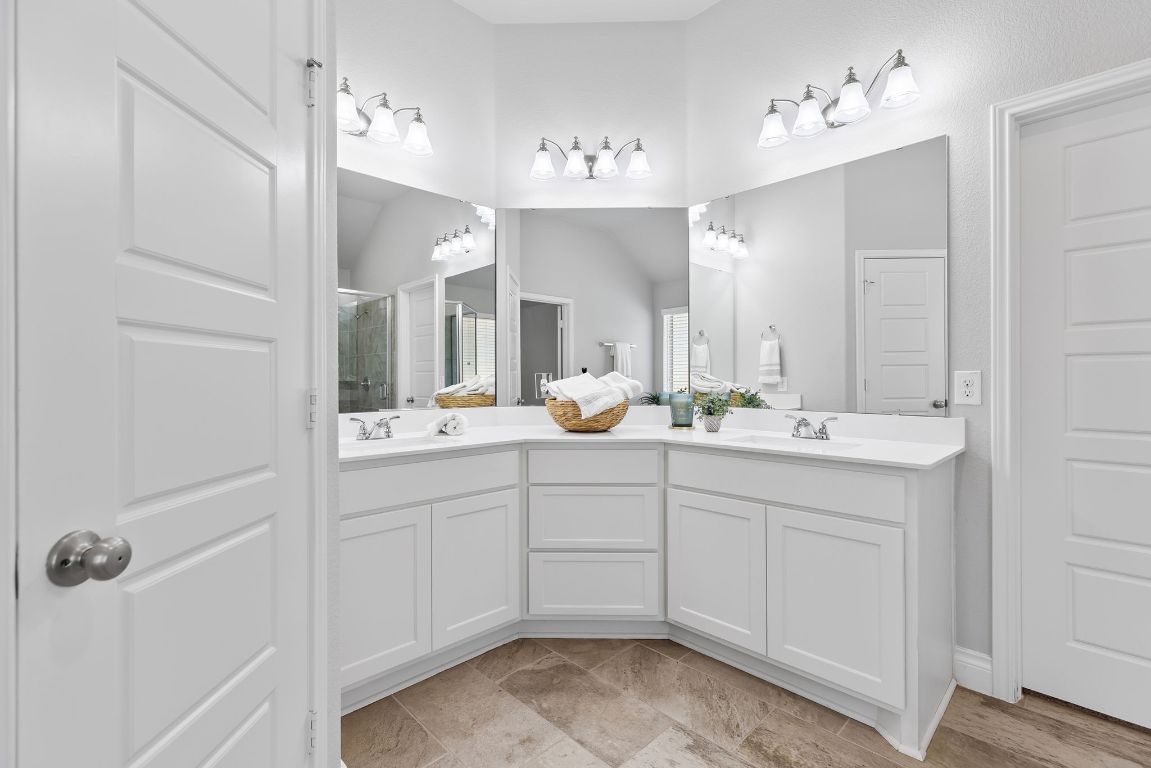 3604 Mercer Road Georgetown, TX 78628 - Photo 23 of 39 a spacious bathroom with a double vanity sink mirror and