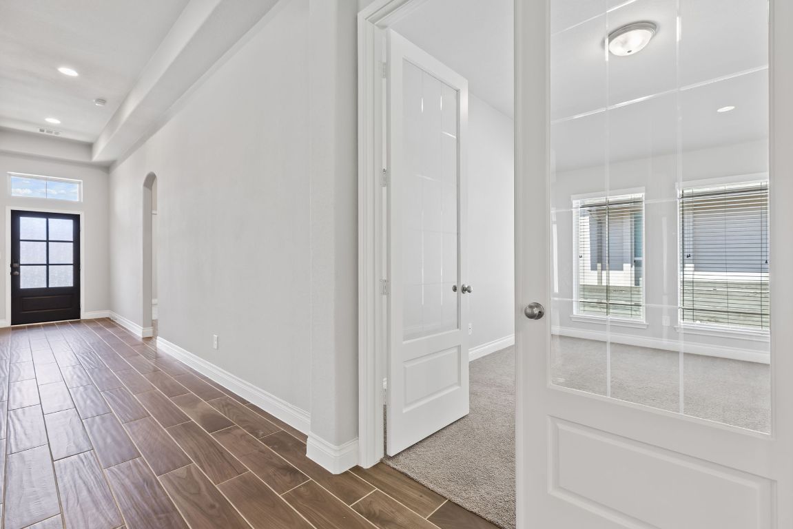 3604 Mercer Road Georgetown, TX 78628 - Photo 25 of 39 a view of empty room with wooden floor and fan