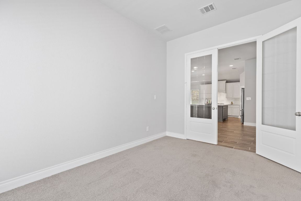 3604 Mercer Road Georgetown, TX 78628 - Photo 27 of 39 an empty room with view of bathroom