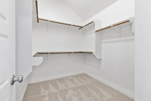 an empty room with view of bathroom