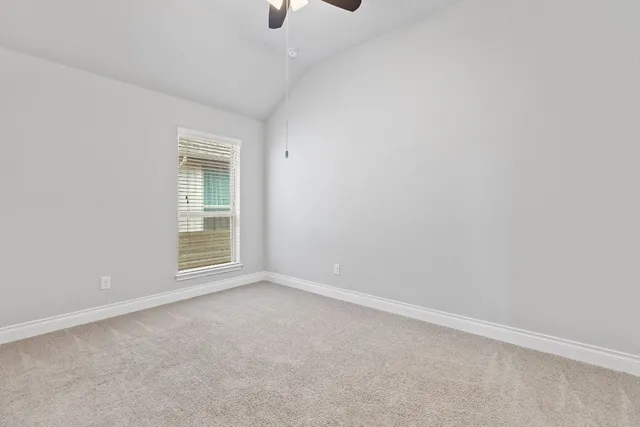 a bathroom with a sink a toilet and shower curtain