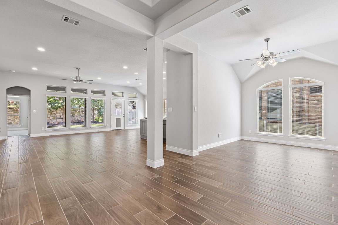 3604 Mercer Road Georgetown, TX 78628 - Photo 10 of 39 an empty room with wooden floor and windows